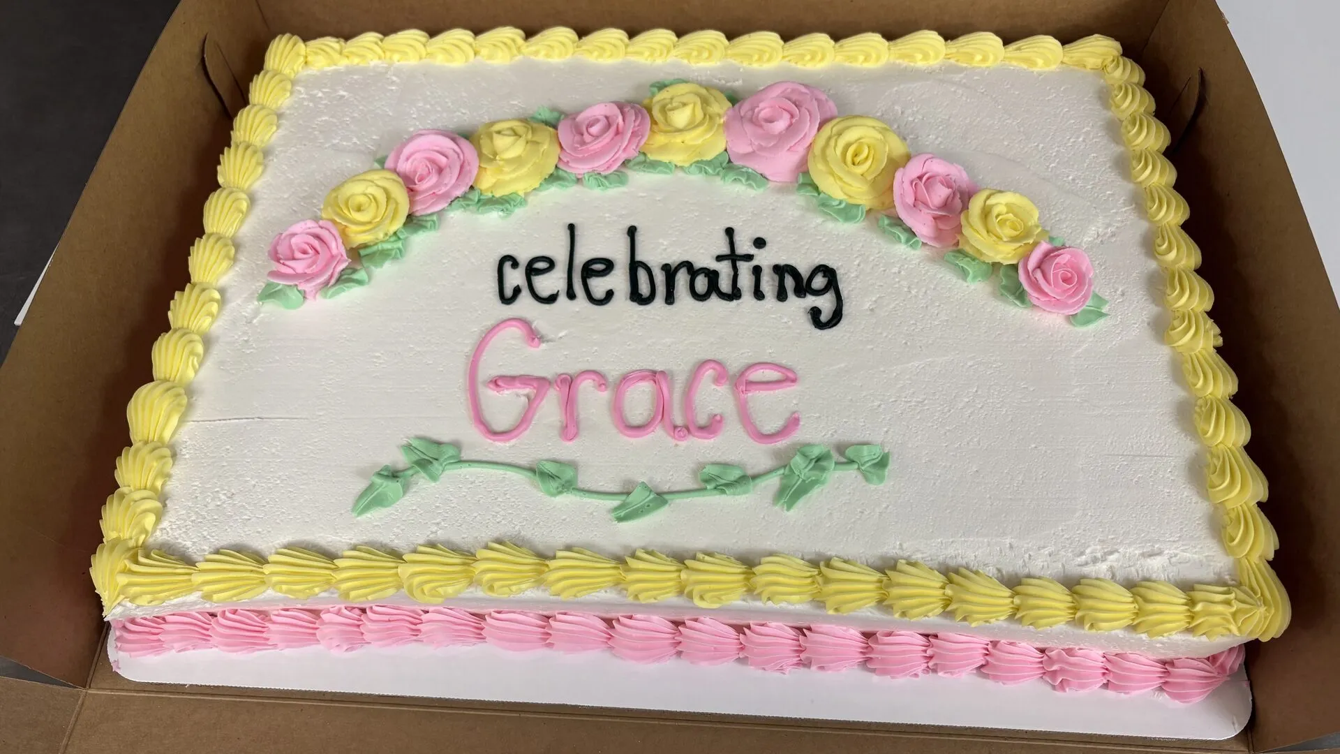 Custom celebration sheet cake with buttercream roses from The Worn Whisk Bakery in New Baden, IL