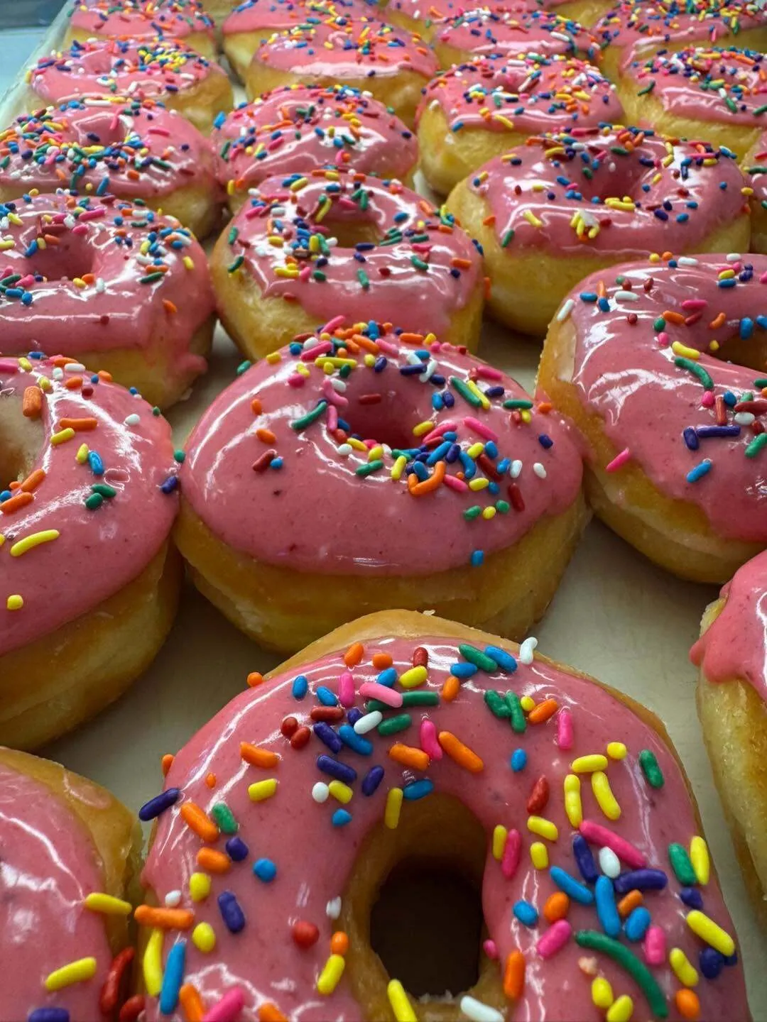 Pink-frosted sprinkle donuts at The Worn Whisk Bakery in New Baden, IL